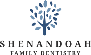Shenandoah Family Dentistry logo featuring stylized tree with dental mirror symbol and business name.