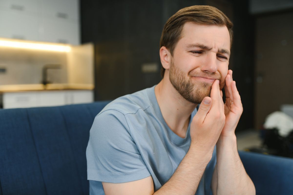 Man suffering from dental pain needs an emergency dentist in Winchester