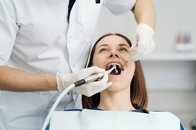 Dentist performing endodontic treatment on a patient