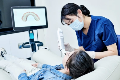 Dentist using an iTero digital scanner for a patient