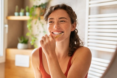 Patient smiling during a routine dental care visit