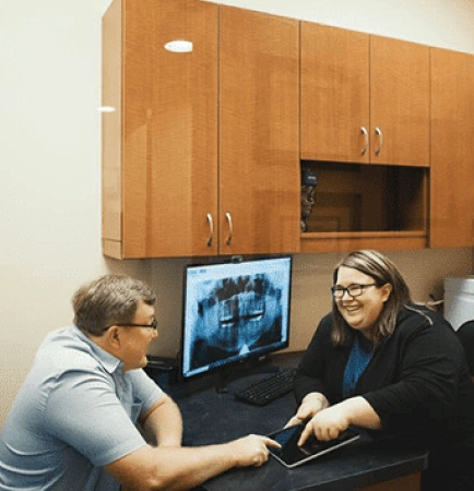 Patient discussing dental treatment and payment options with a team member at Shenandoah Family Dentistry