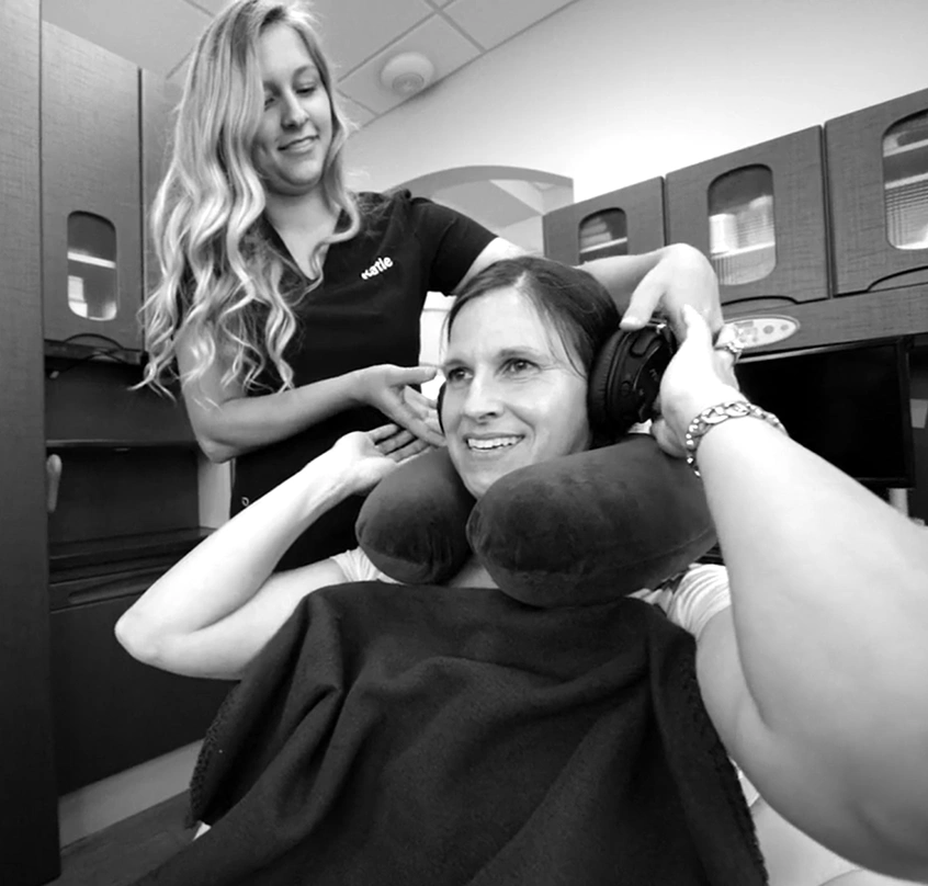 Dental team member helping a patient relax during a visit