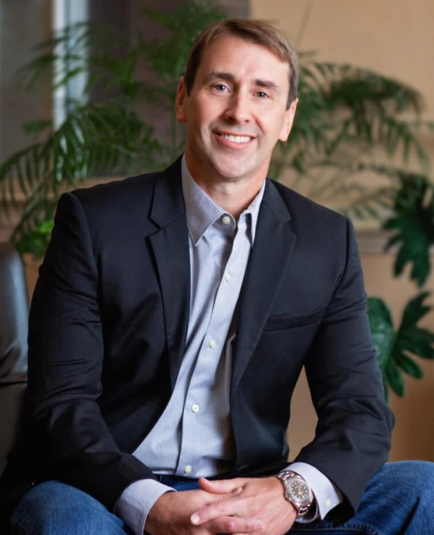 Dr. Jared Pell smiling in a dental office